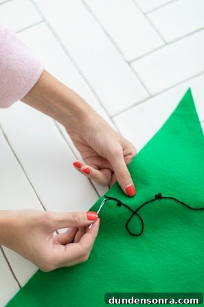 DIY Felt Christmas Tree Wall Hanging Tutorial for Festive Decor 9 Green felt and black string