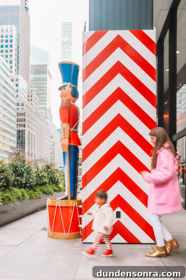 Arlo’s First Christmas in New York City: A Festive NYC Holiday Adventure 15 A person standing in front of a building