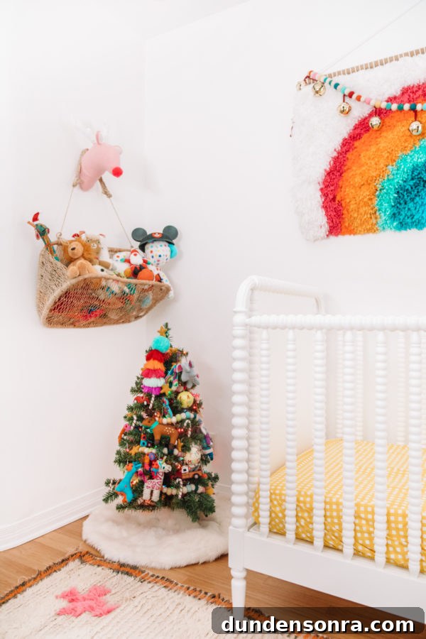 Holiday Home Tour: Inside The Mindwelling’s Festive Decor 23 A mini Christmas tree next to a crib