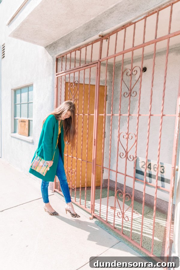 10 Lessons I Wish I Knew Before Starting My Business 3 A person standing in front of a pink gate