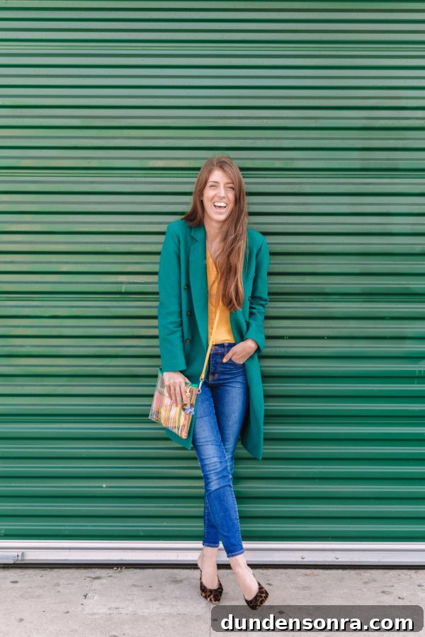 10 Lessons I Wish I Knew Before Starting My Business 7 A woman standing in front of a green wall