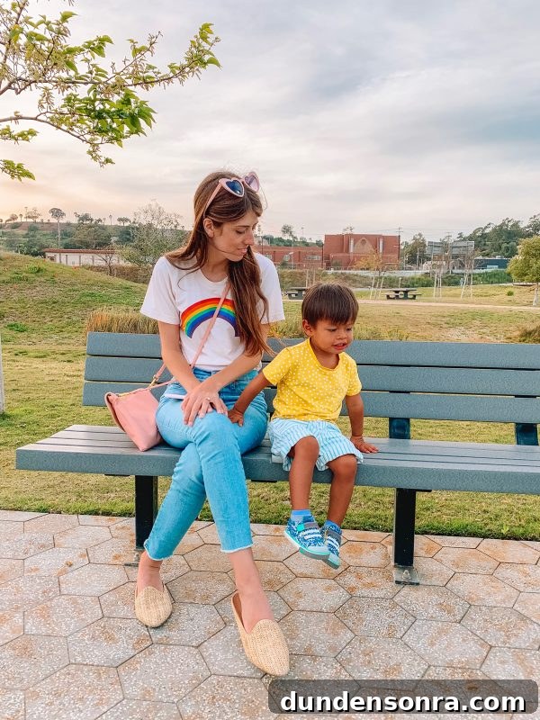Two people sitting on a park bench