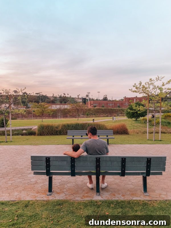A person sitting on a park bench