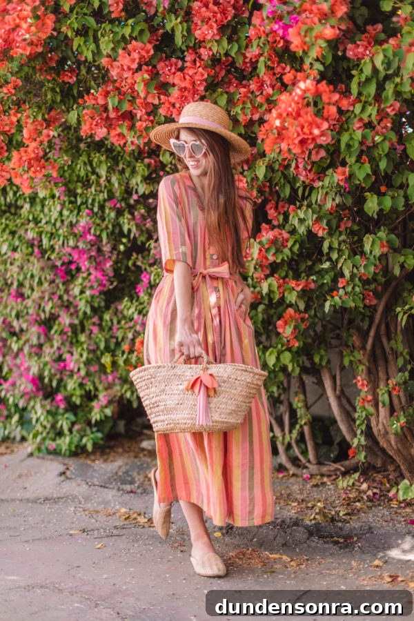 A woman standing in front of flowers
