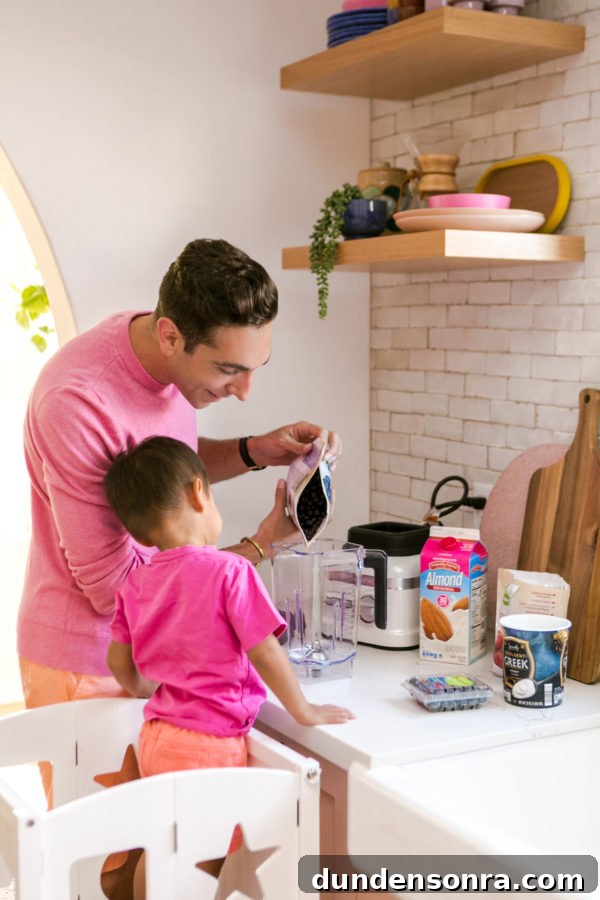 A person and a little boy that is standing in the kitchen