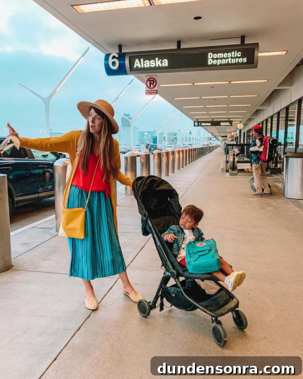 A group of people standing around at an airport