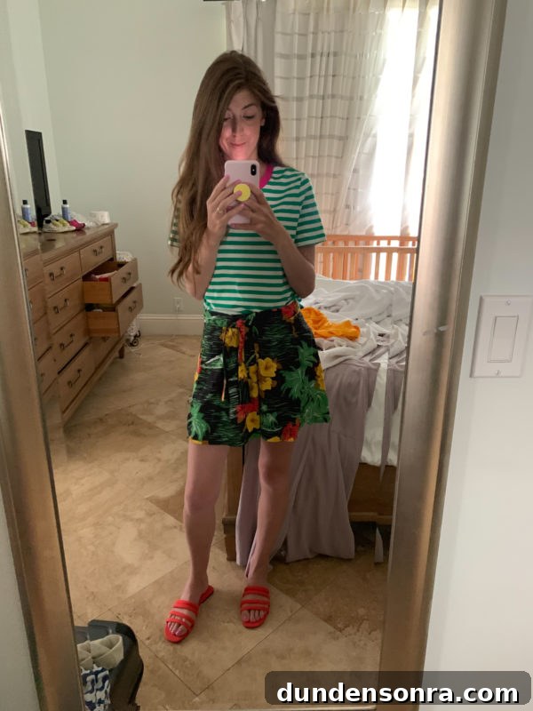 A person standing in front of a window
