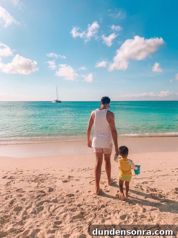 Beaches Turks and Caicos Review: Tips for Traveling with Toddlers 15 Two people standing on a beach