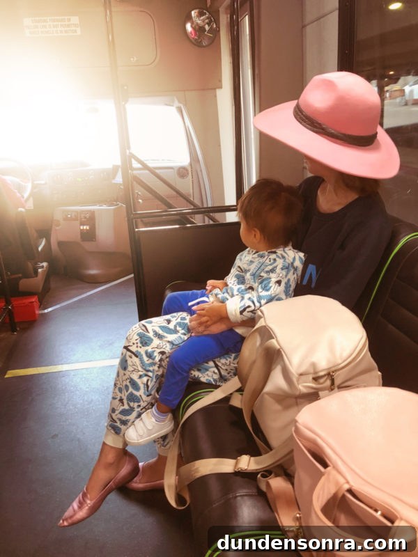 Flying With a Baby or Toddler: Tips, Gear & Plane Activities 7 Two people on a train