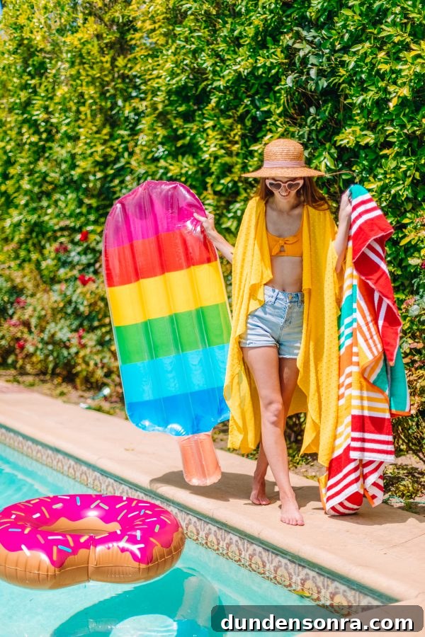 Family Pool Day Packing List: Essentials for Parents and Kids 2 A person wearing a hat holding a rainbow floatie