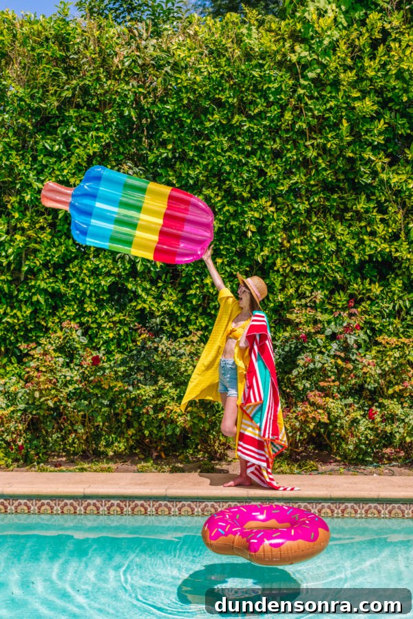 Family Pool Day Packing List: Essentials for Parents and Kids 10 Girl holding a rainbow popsicle floatie