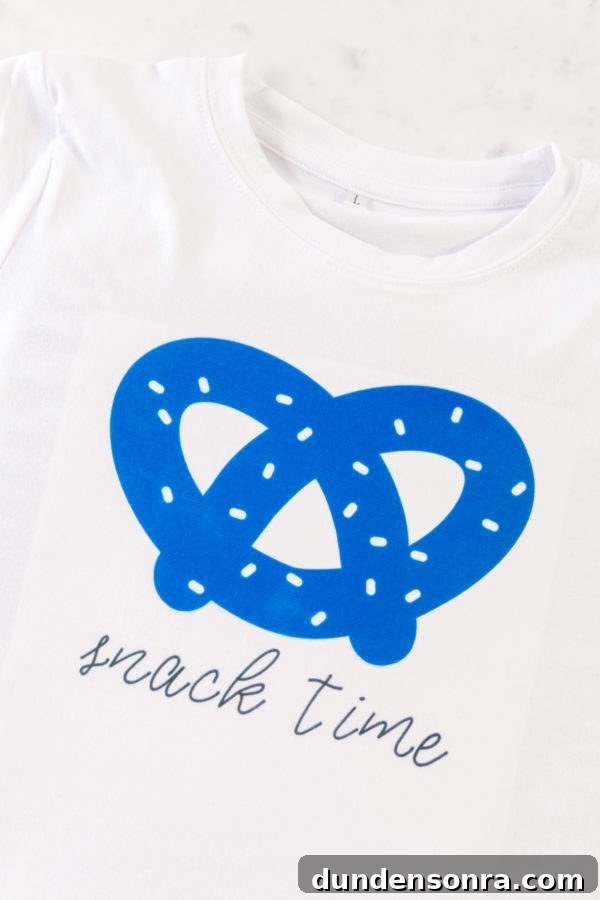 A close up of a blue pretzel on a shirt