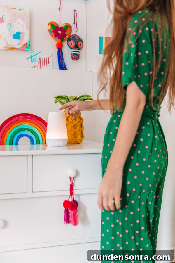 Hatch Baby Rest+ Review and Smart Sleep Tips for New Parents 3 A girl touching a light