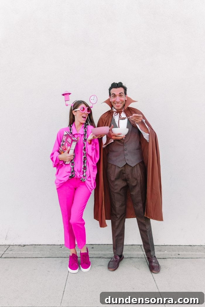 Man and woman holding a costume