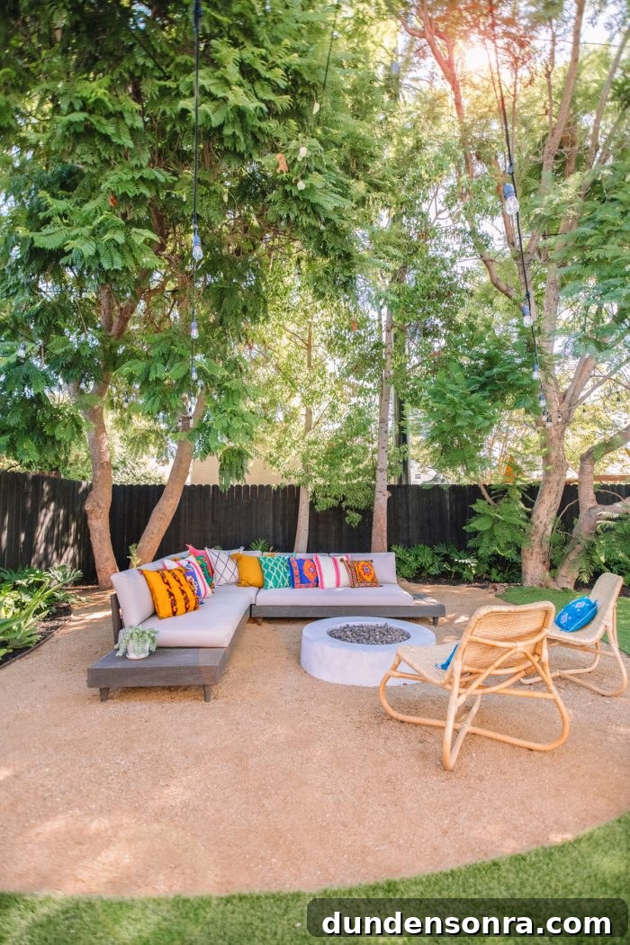 A fire pit with an outdoor couch and chairs