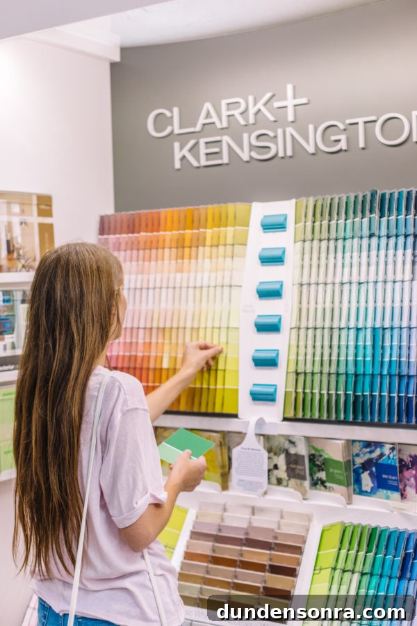 A person looking at paint samples