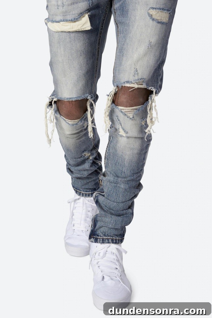 Ripped jeans on man with white sneakers