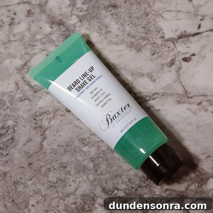 Green bottle of shave gel on marble background