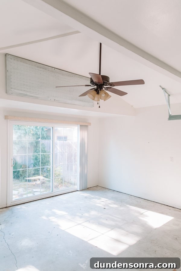 An empty room with a fan