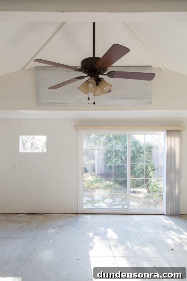 An empty room with a fan