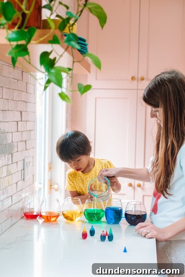 A woman standing in a kitchen with her son