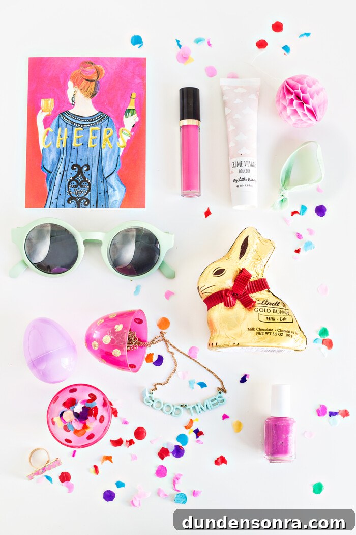 Easter basket goodies placed on a white background. 