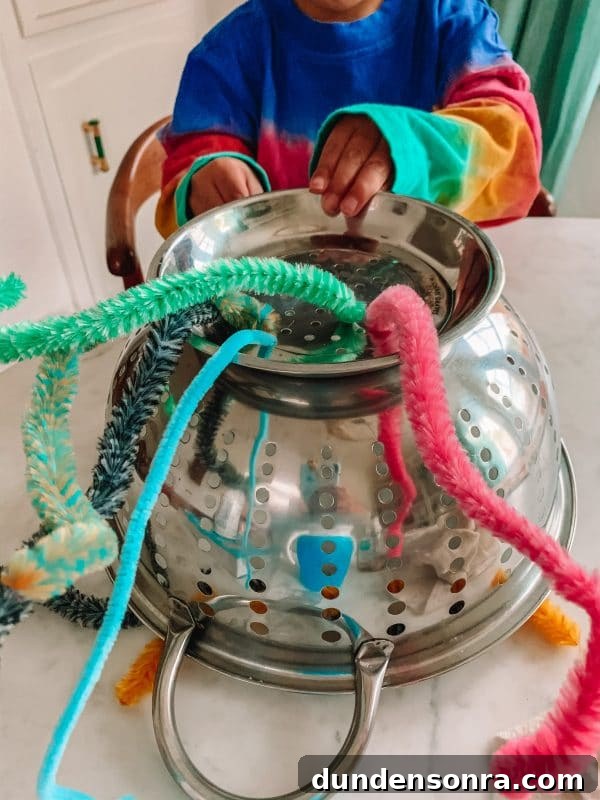 Space Day Activities and Crafts for Toddlers: Fun Themed Ideas 4 pipe cleaner colander UFO fine motor activity