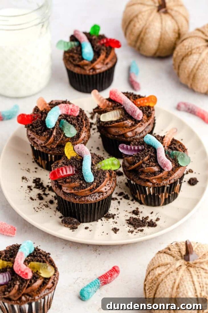 24 Fun Bug Crafts and Activities for Kids to Try Today 22 Halloween dirt cupcakes on a plate.