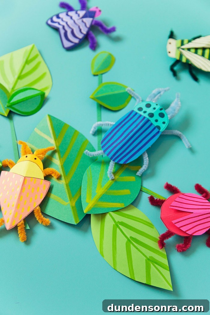 24 Fun Bug Crafts and Activities for Kids to Try Today 4 Paper bug crafts on table.