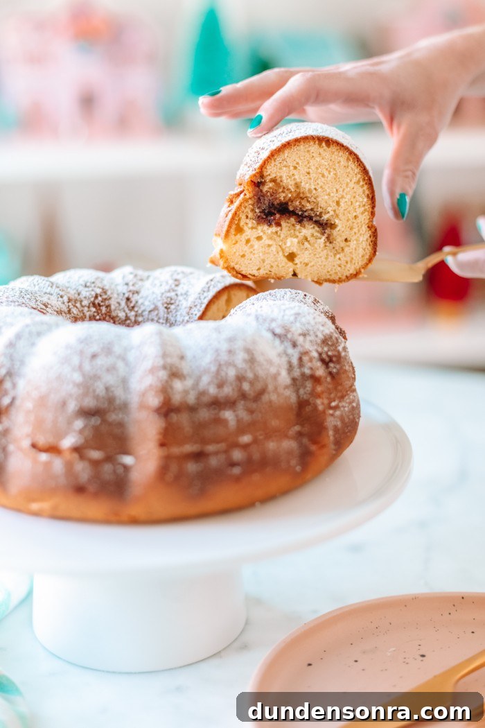 Favorite Breakfast Recipes Our Family Loves 13 Slice of coffee cake being lifted out of bundt cake