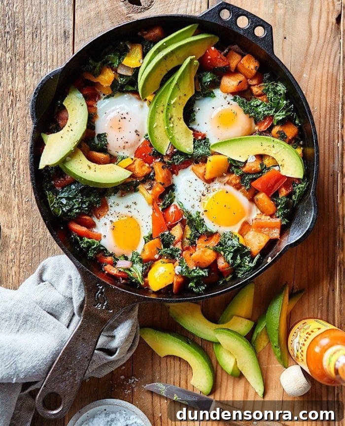 Favorite Breakfast Recipes Our Family Loves 10 Sweet Potato Hash in a cast iron skillet on a wood board