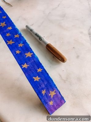 Build a Cardboard Dumbo Ride: Step-by-Step DIY Guide 11 Blue cardboard with gold stars