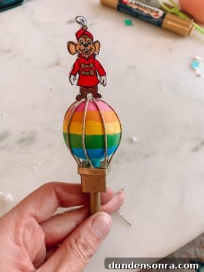Build a Cardboard Dumbo Ride: Step-by-Step DIY Guide 28 Cardboard rainbow hot air balloon