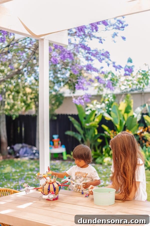 Build a Cardboard Dumbo Ride: Step-by-Step DIY Guide 30 A little boy playing with a toy