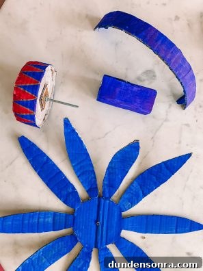 Build a Cardboard Dumbo Ride: Step-by-Step DIY Guide 9 Blue flower