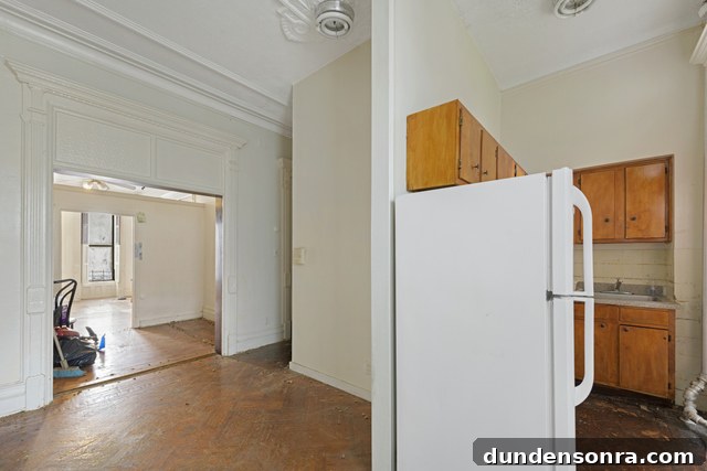 The corner of a kitchen and a wooden floor