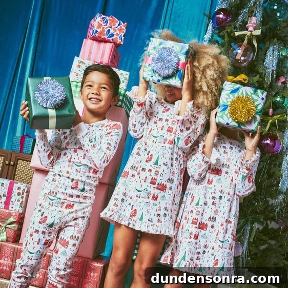 Kids with presents in christmas pajamas