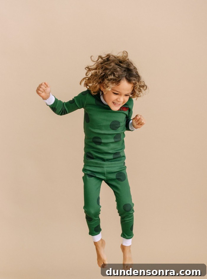 child in green polka dot pajamas