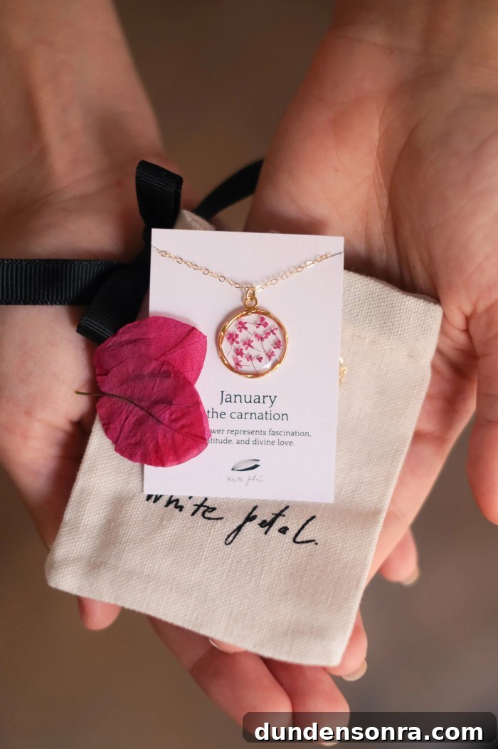 flower necklace held in hands
