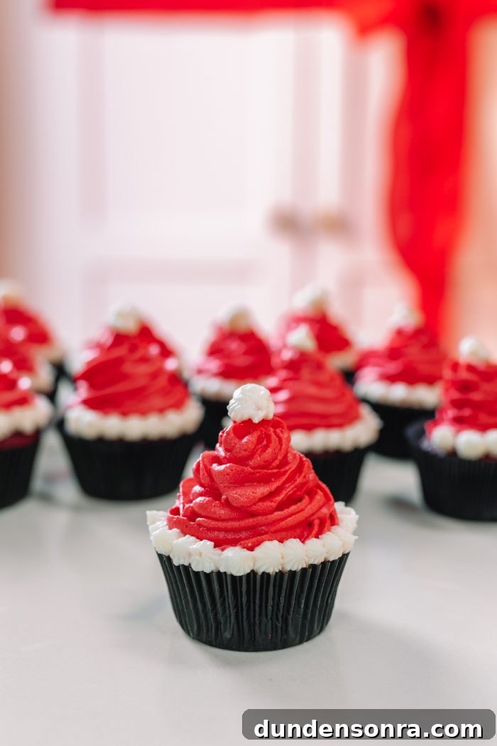 Santa Hat Cupcakes: Festive Holiday Recipe for Homemade Treats 12 Multiple santa hat cupcakes on a table