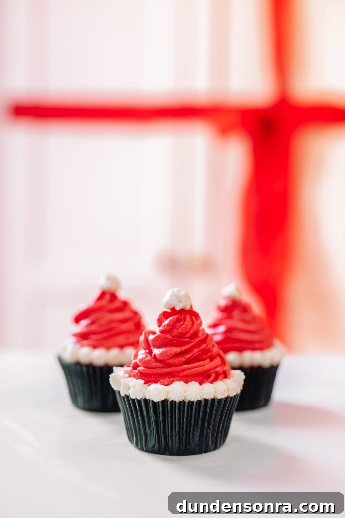 Santa Hat Cupcakes: Festive Holiday Recipe for Homemade Treats 3 A close up of three santa hat cupcakes