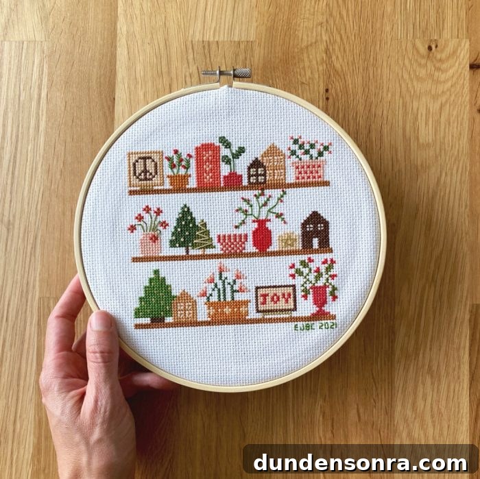 Christmas on shelves with houses, trees, and signs