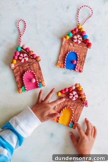 Three wooden gingerbread house ornaments 