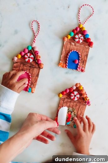 Three gingerbread house ornaments