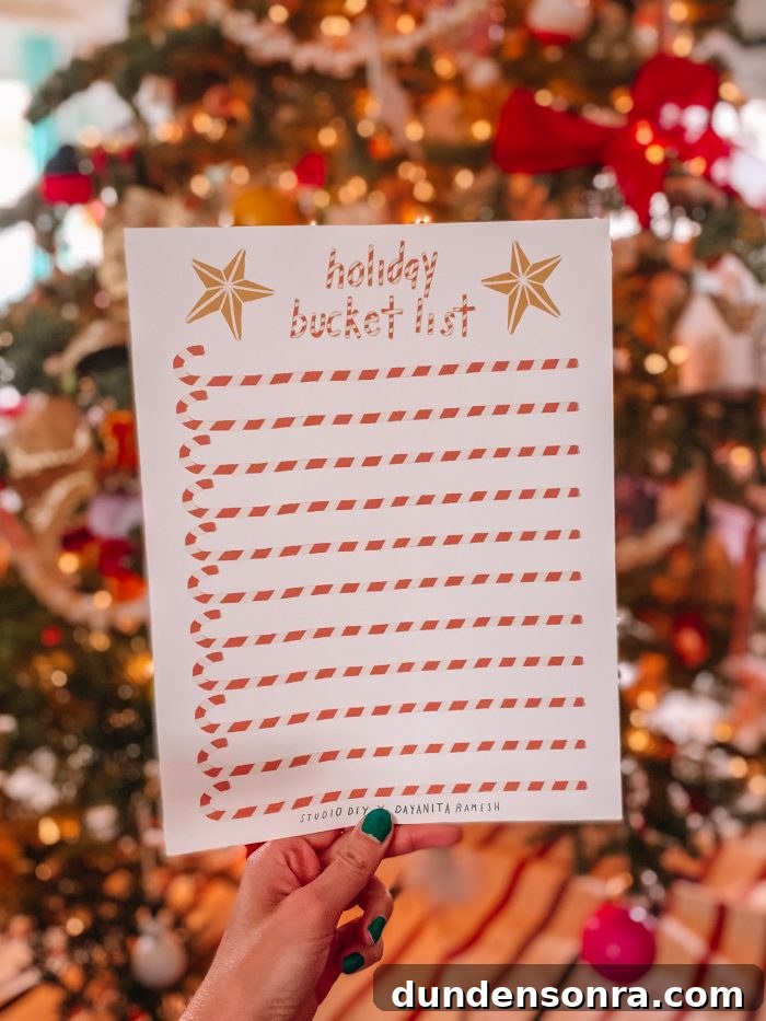 Hand holding a piece of paper with candy canes printed on it. 