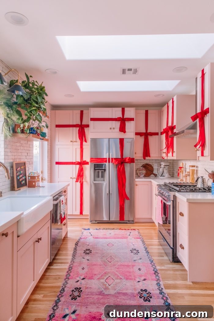 Kitchen with cabinets wrapped in red ribbon to look like presents. 