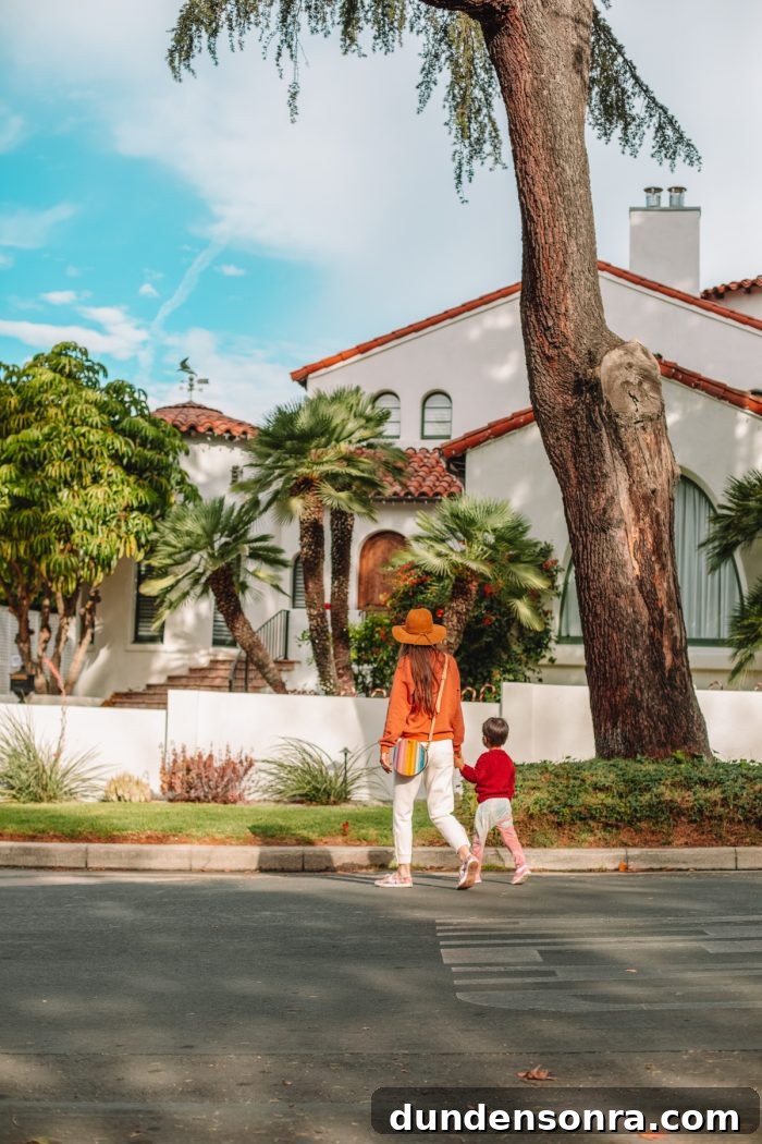 A woman and her son in front of a Spanish house