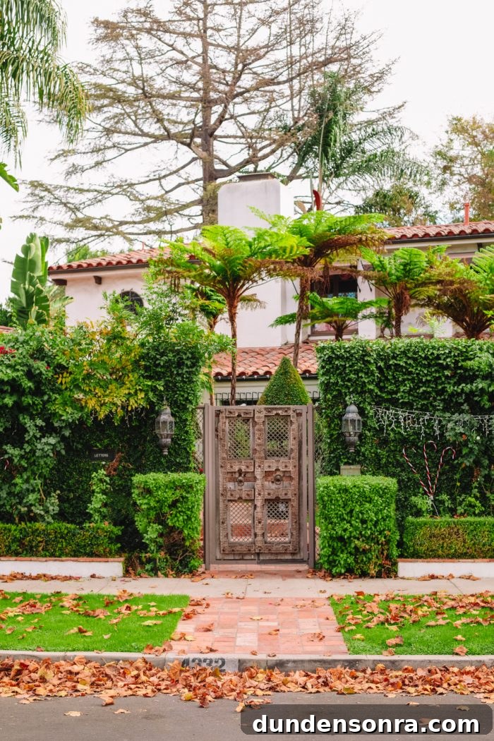 The front of a Spanish house with lots of plants