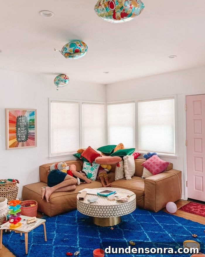 A living room with a pillow fort on the couch