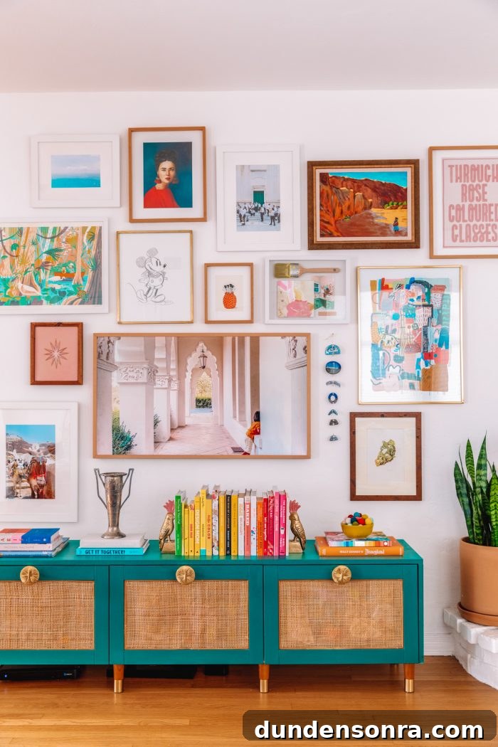 Rattan IKEA Besta TV Stand Makeover: Step-by-Step Hack 3 Rattan IKEA Besta Hack underneath a gallery wall with rainbow books on top